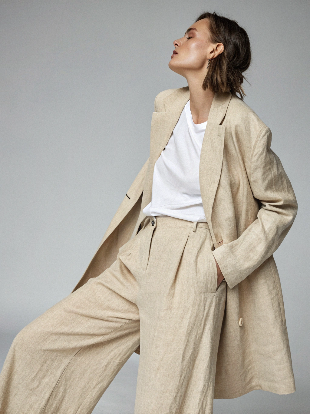 Model styled in relaxed minimal tailoring suit