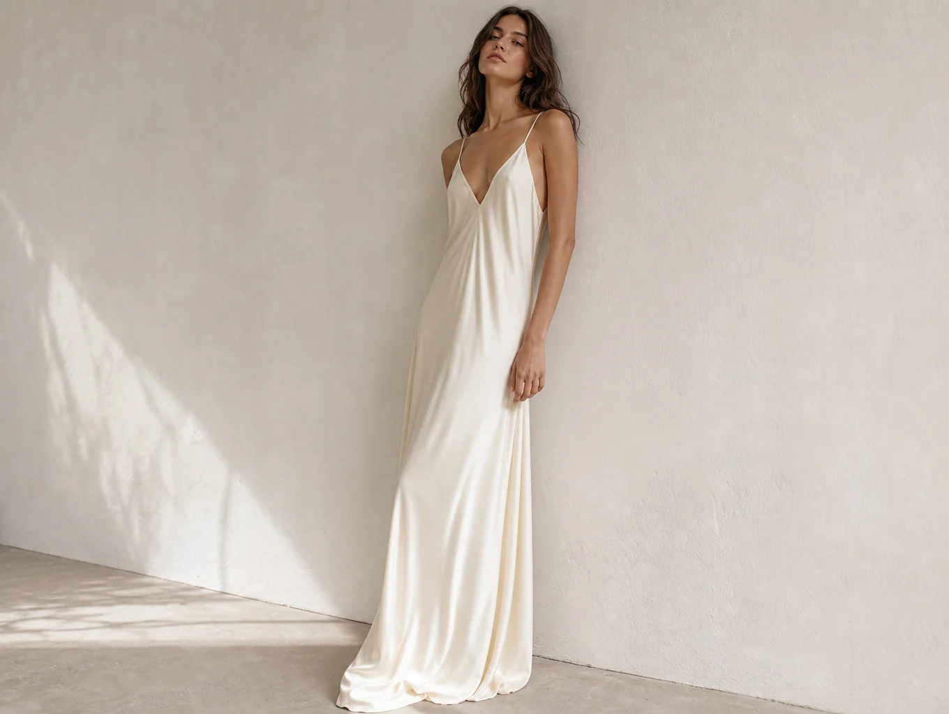 High fashion model in tailored ivory structured dress in natural daylight
